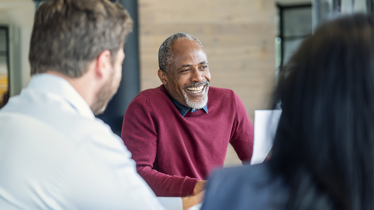 A man in a red sweater
